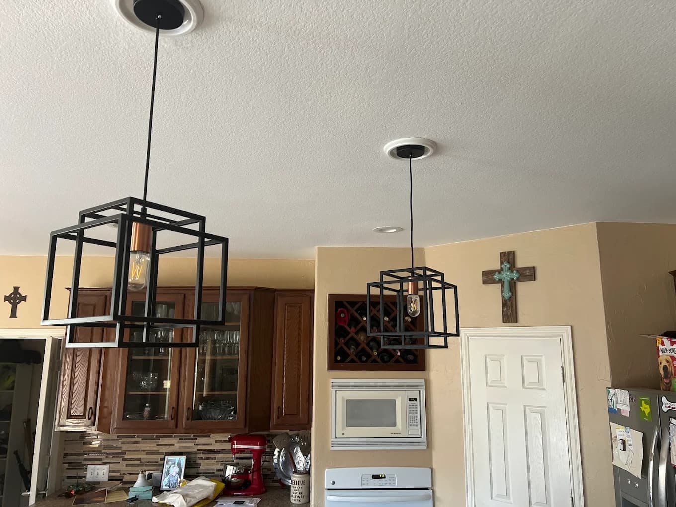 Pendant lighting installation over a kitchen island